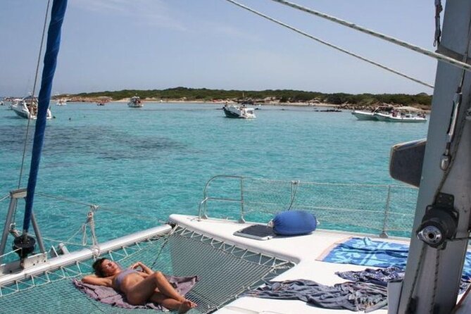 2-Catamaran tour from Cannigione to the Maddalena Archipelago - Razzoli and Santa Maria Inside the Park: Cliffs, Passages, and Snorkel Zones