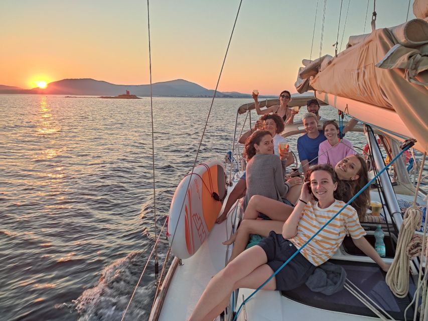 Alghero: Sunset Sailing Aperitif Experience - Aperitivo on board: beer, local wine, spritz, snacks, and music