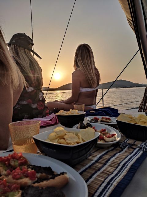 Alghero: Sunset Sailing Aperitif Experience - Getting to the boat: Pier 5, Rainbow, and the 15-minute walk