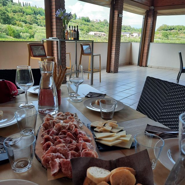 Bardolino: Vineyard Tour with Wine, Olive Oil & Food Tasting - The terrace tasting setup: EVOO first, then 5 wines
