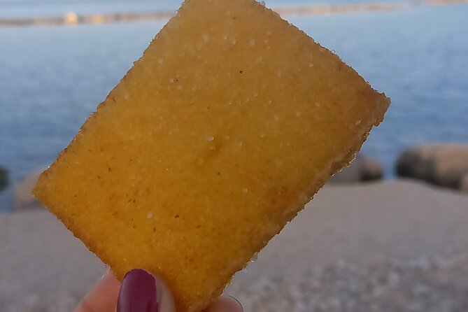 Bari’s Ultimate Street Food Tour - Small Group by Do Eat Better - Stop 4 along Corso Vittorio Emanuele II: an octopus sandwich with a sea-salt bite
