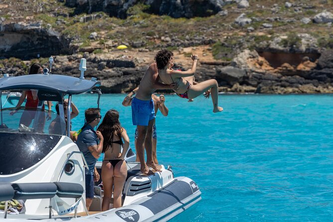Boat Tour Egadi Day discover Favignana and Levanzo from Trapani - Stop 3: Scogliera di Cala Rossa and the “Fish Everywhere” Beach