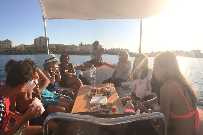 Boat tour of Ortigia Island and sea caves - Swim option and getting comfortable on board
