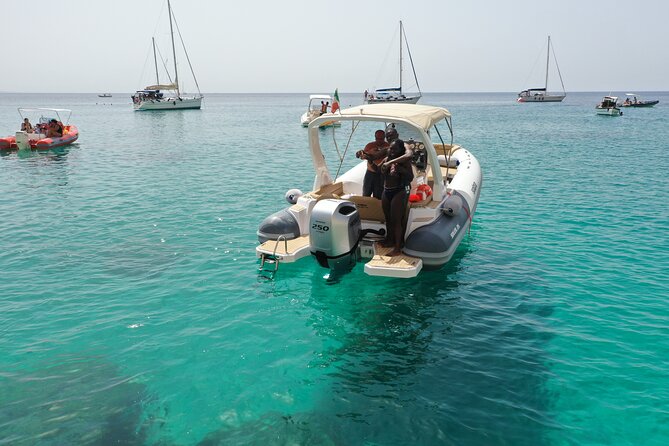 Cagliari Boat Tour 4 Stops .Possible Sighting of Dolphins - Entering the water: what this Cagliari boat tour feels like