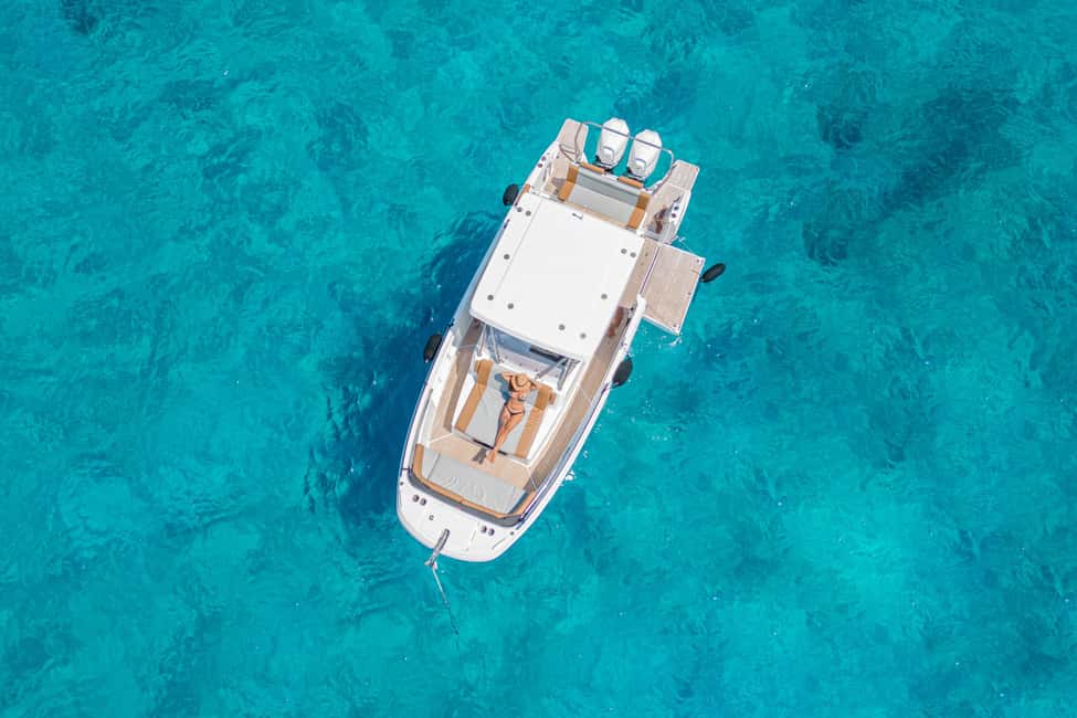Cagliari: Luxury Motorboat Tour with 3 Swim Stops & Wine - Setting sail from Marina Piccola: luxury that still feels real
