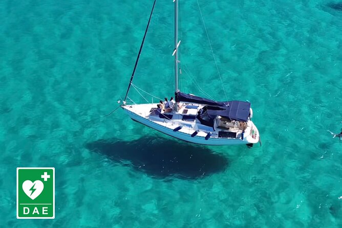 Catamaran tour stops bathing and snorkeling toast with prosecco - The first bay: military leftovers, terraced shores, and Capo Sant’Elia