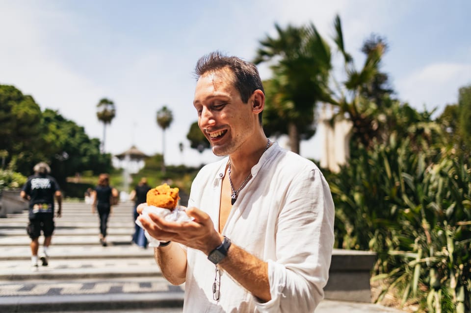 Catania: Guided Street Food Walking Tour - Meeting at Sicilying and starting down Via Crociferi