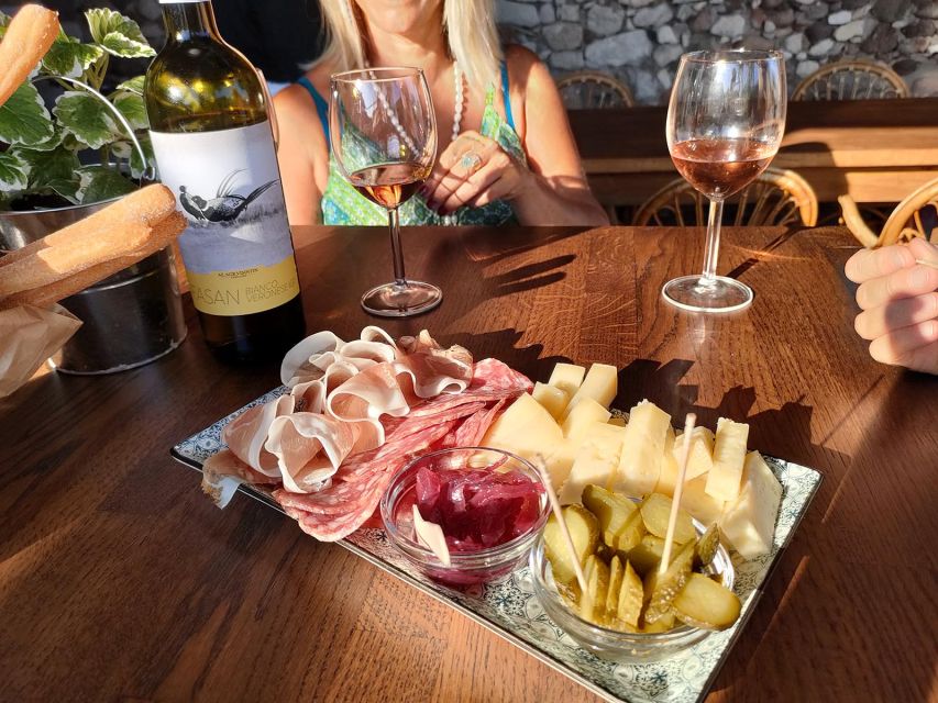Cavaion: Lake Garda Wine & Food Tasting with Vineyard Tour - Under the grape arbor: the tasting setup you can actually relax in