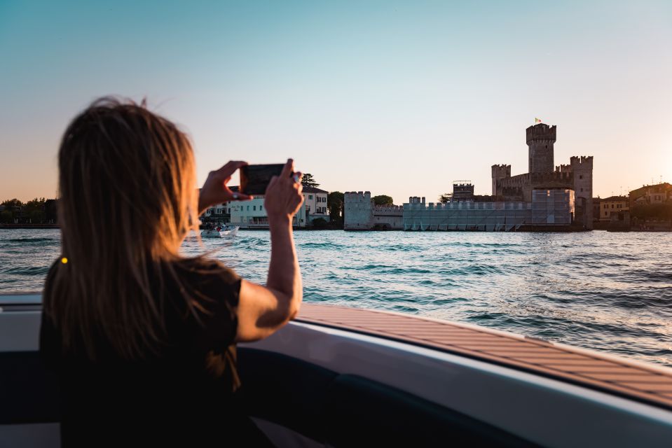 Desenzano del Garda: Sunset Boat Trip at Sunset with Drink - Sunset Views Over Sirmione From the Water