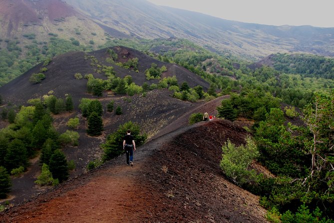 Etna excursion - The cave of lava flow: helmets, torches, and real underground geology