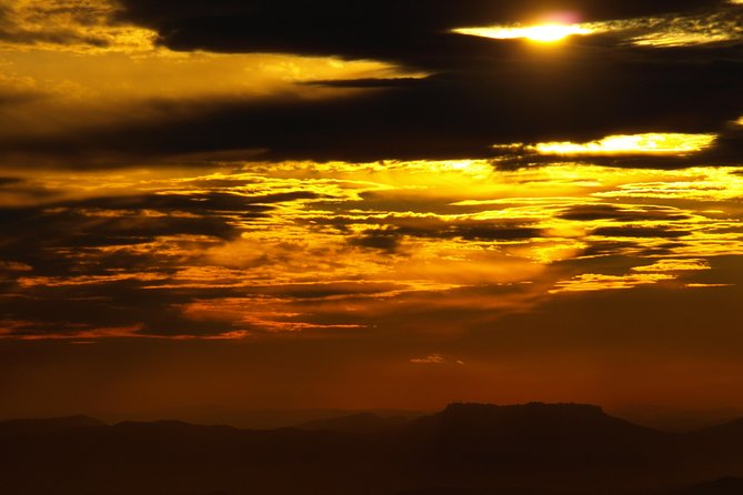 Etna Sunset - Helmets, torches, and a lava-flow cave you actually walk into