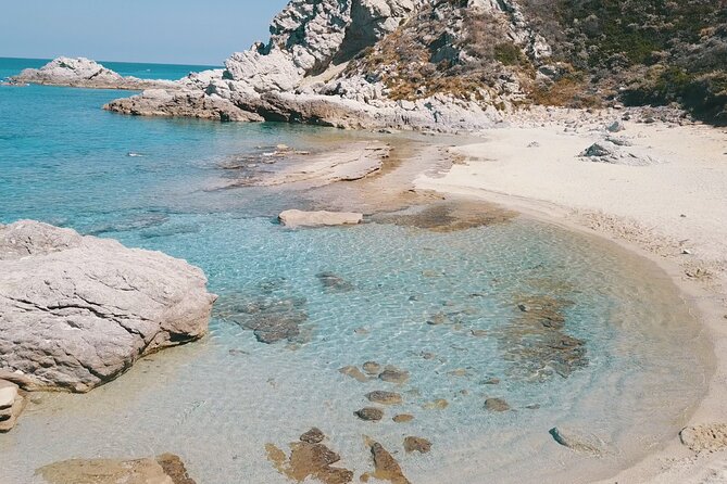 Exclusive boat tour for up to 8 people, beautiful Tropea - Spiaggia Di Riaci: caves, a natural channel, and colorful water (Stop 5)