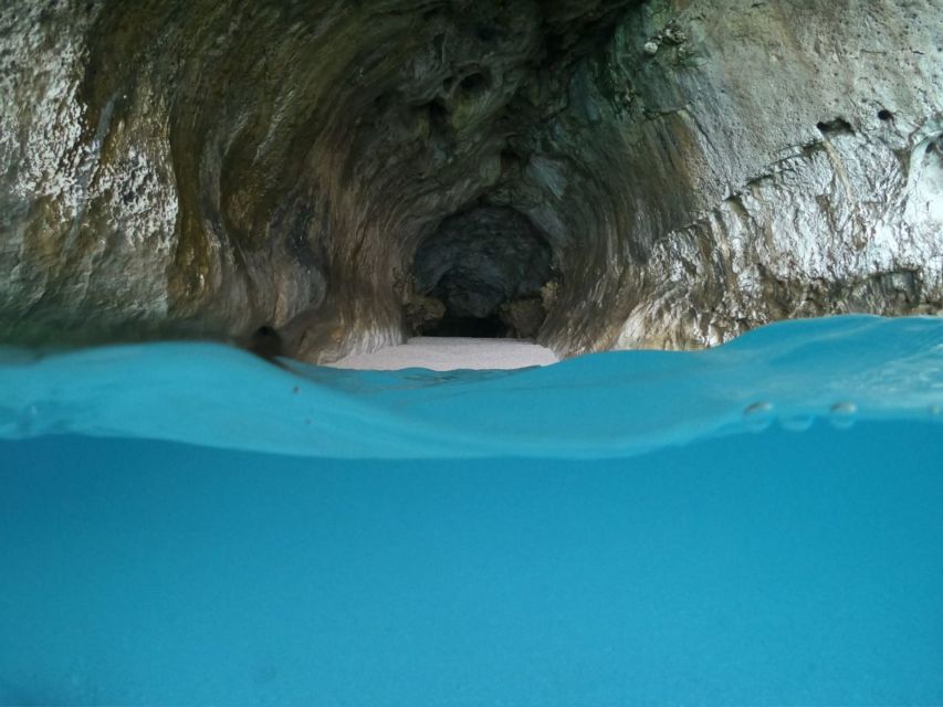 From Cala Gonone: Gulf of Orosei Dinghy Trip - Aperitif on board: the wine and Sardinian sweet you’ll actually remember