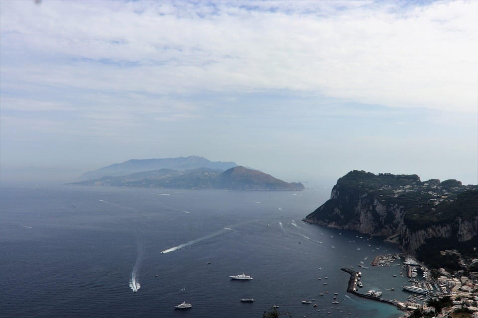 From Naples: Blue Grotto, Capri, and Anacapri Group Tour - Capri town time: Piazzetta Umberto I, shopping streets, and Via Camerelle