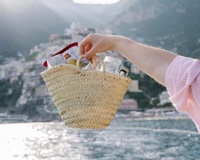 From Positano: Amalfi Coast Sunset Cruise - Group Tour - Meeting at Positano Boats: Spiaggia Grande, blue and white gazebo