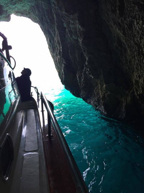 From Sorrento: Capri Guided Boat Tour - The grotto lineup: Blue, Green, White, and the Faraglioni sweep