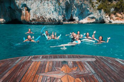 From Sorrento: Capri Island Boat Day Trip With Transfer - The yacht ride around Capri: grottos, Faraglioni, and lighthouse views