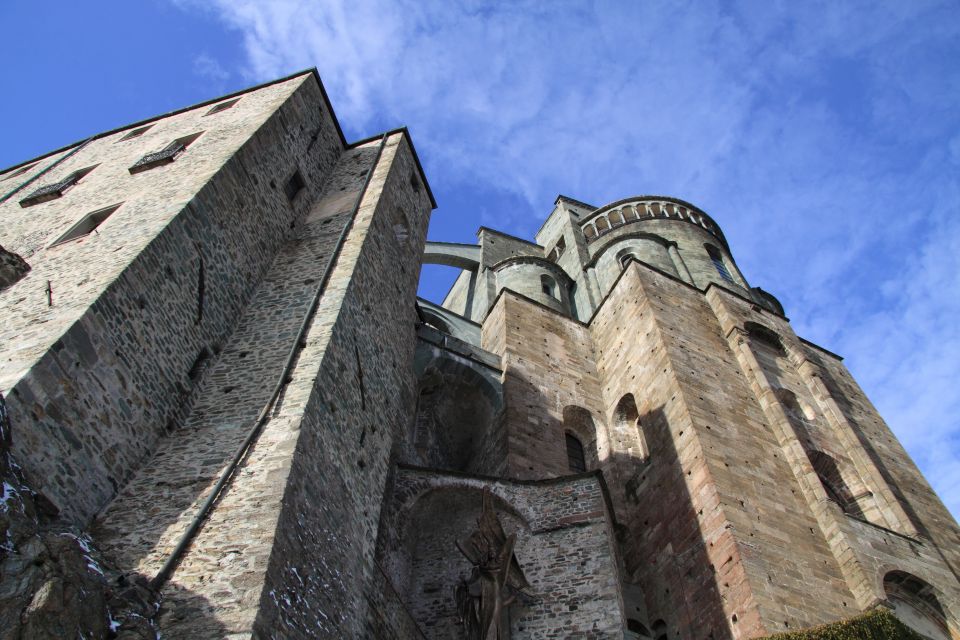 From Turin: Half-Day Medieval Sacra di San Michele Tour - The Porta dello Zodiaco: the 243-step climb with a purpose