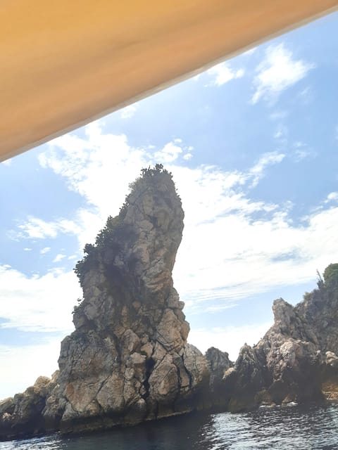 Giardini Naxos: Isola Bella and Grottos Cruise with Aperitif - Aperitif on the Water: Prosecco, Sicilian Almond Paste, and a Slow Down