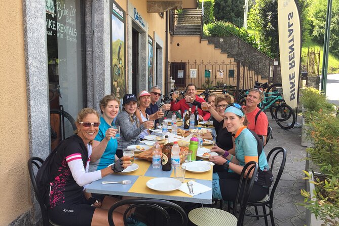 Group Bike Tour: Onno & Ghisallino (E-bikes and Road bikes) - Passing through a charming town off the main road