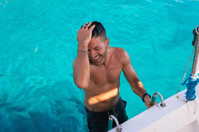 Guided day by boat in Carloforte with snorkelling and aperitif - Cala Mezzaluna: The Natural Theater for Snorkelling