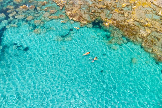 Guided day by boat in Carloforte with snorkelling and aperitif - Capo Sandalo and Le Spine: Lighthouse Views and Lunch
