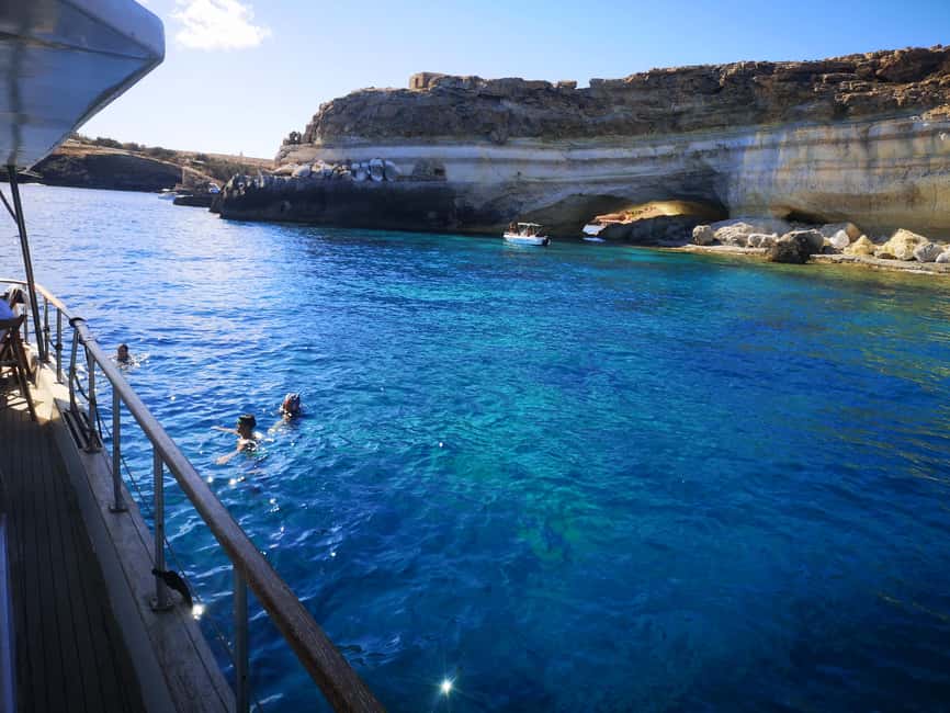Lampedusa: Yacht excursion, swimming stops and typical lunch - Lunch on board: fish pasta, caponata, and table service