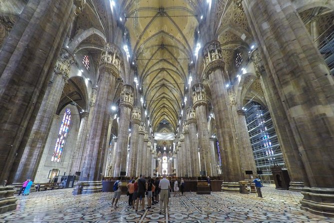 Milan Super Saver: Skip-the-Line Duomo and Rooftop Guided Tour - Inside the Cathedral: Stained Glass, Art, and Those Overlooked Corners