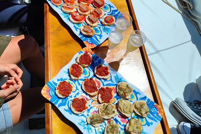 One day excursion on a sailing boat in the Gulf of Alghero - Torre del Lazzaretto: aperitif vibes and the “one more swim” plan