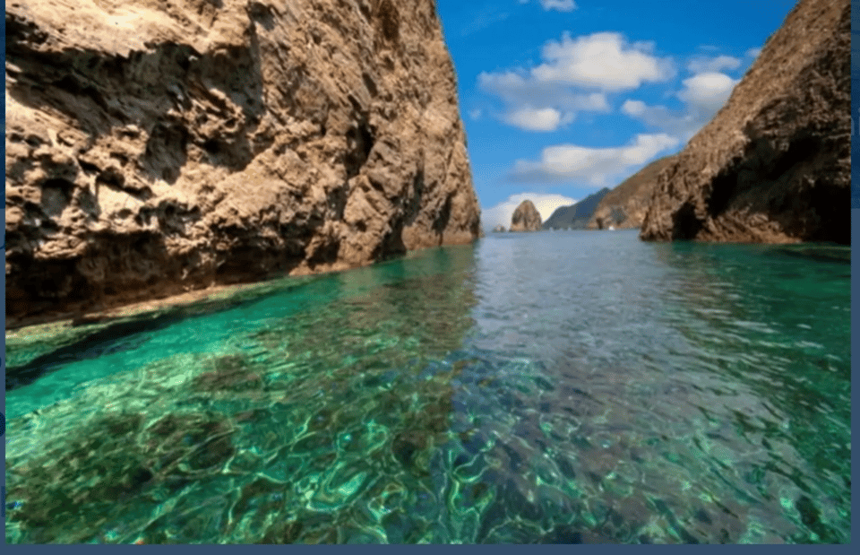 Ponza/Palmarola boat tour with lunch on board - Palmarola marina and rock-carved houses: the only land moment