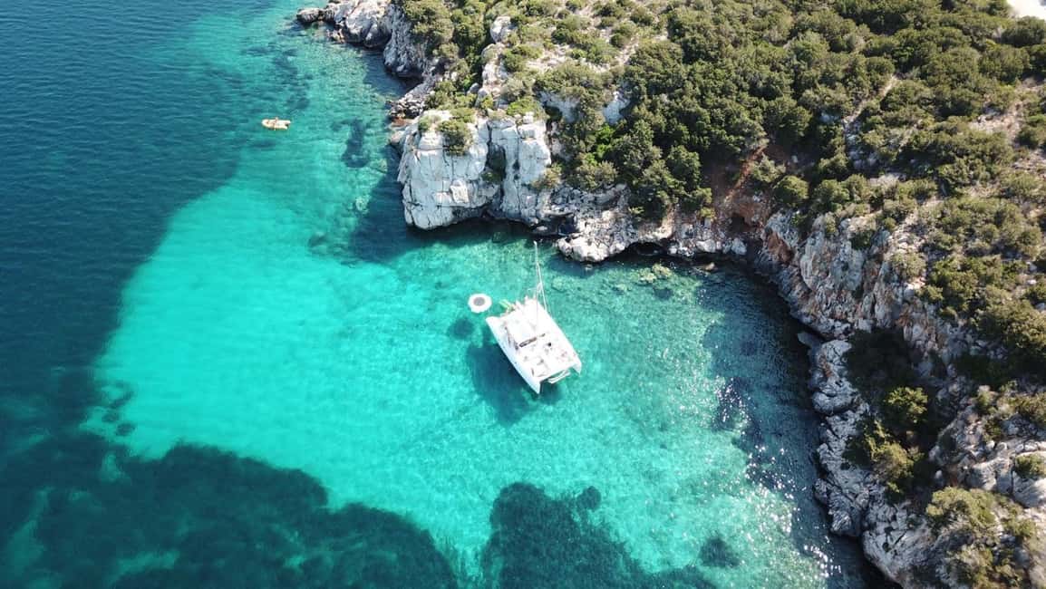 Porto Conte: Half-day catamaran tour with aperitif - Cala Dragunara: The Anchored Water Stop You Actually Wait For