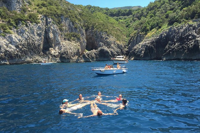 Private Tour: Amalfi Coast to Capri Cruise - Capri from the water: Faraglioni, harbors, and the red modern villa