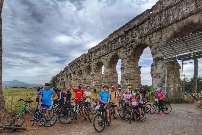 Rome: Appian Way E-bike Tour, Catacombs, Aqueducts & Transfer - Bikes, helmets, ponchos, and comfort on rough Roman paving