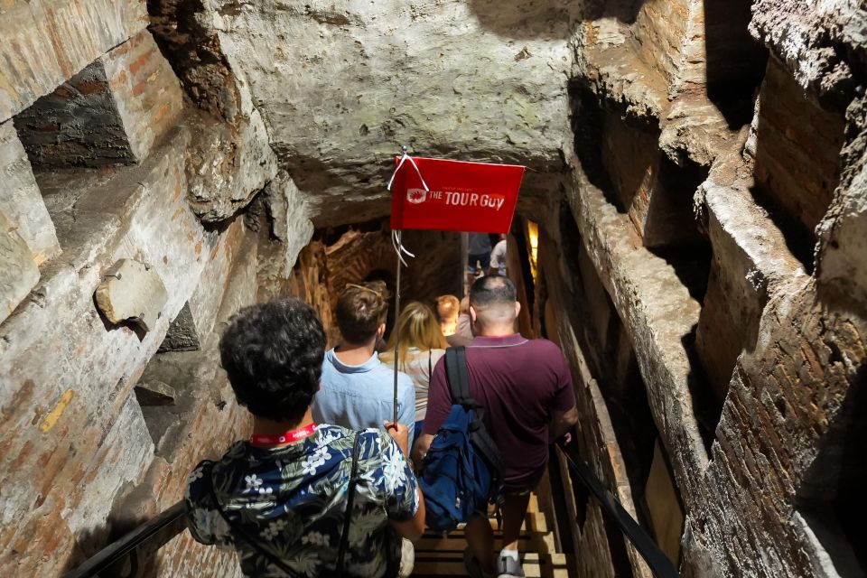 Rome: Catacombs and Capuchin Crypt Guided Tour with Transfer - Appian Way and Aurelian Wall passes: quick views, useful context
