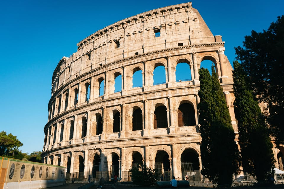 Rome: Colosseum, Roman Forum, and Palatine Hill Experience - Imperial Fora: the power walk between columns and ruins