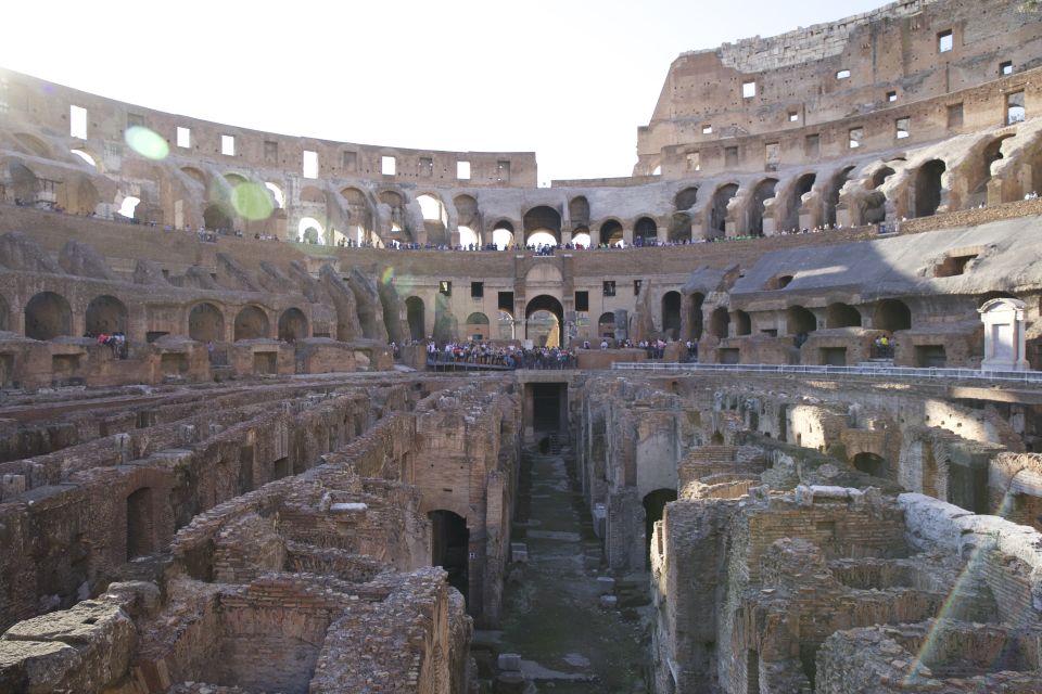 Rome: Colosseum, Roman Forum and Palatine Hill Group Tour - Stopping at Constantine, Titus, and Other Power Symbols