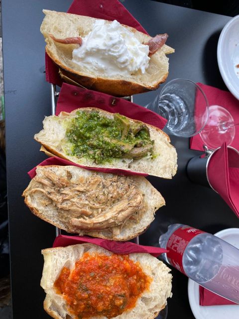 Rome: Food Tour with Unlimited Food and Barolo Wine - Stop 1 at the gourmet shop: aged Parmesan, balsamic magic, and mozzarella you can taste