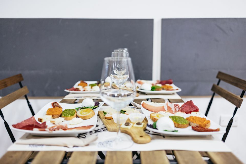 Rome: Food Tour with Unlimited Food and Barolo Wine - Wine, pesto, and cured meats: the first restaurant stage