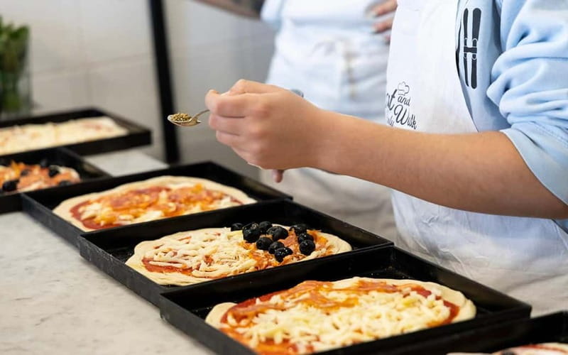Rome: Pizza and Tiramisù Cooking Class with Glass of Wine - Eating the meal: wine with your own pizza and tiramisù