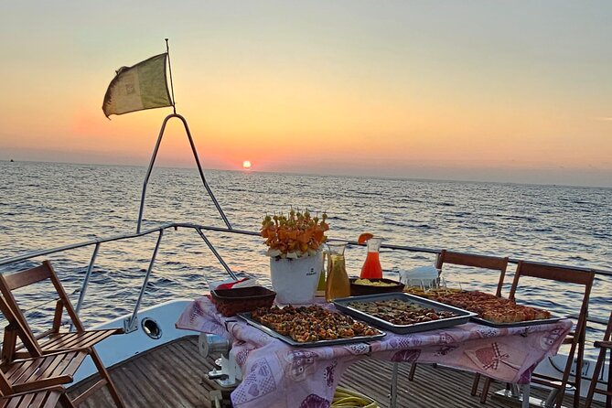 SciatumiaDay boat tour to Lampedusa with typical lunch - Lampedusa cove lunch: table service and more swimming time