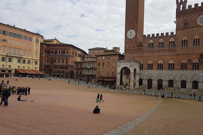 Siena and San Gimignano from Rome: Wine Tasting Tour in Tuscany - Tenuta Torciano Winery: Tastings, Oil, and Lunch With Real Energy