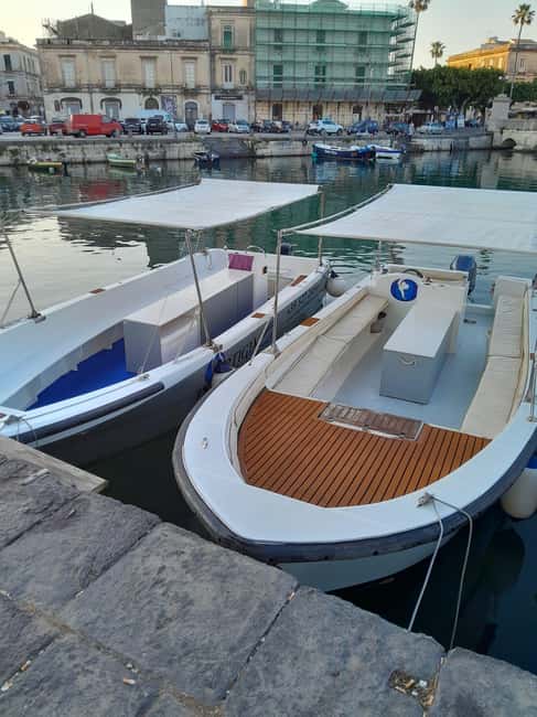 Siracusa: Ortigia Boat Tour with Marine Grotto - The Long-Tail Boat Ride: Comfort, Sights, and Tight Harbor Moments