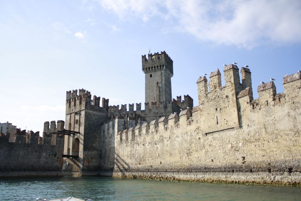 Sirmione: Scenic Afternoon Boat Cruise with Prosecco & Snack - Gardone Riviera, sulfur springs, and the return under the drawbridge