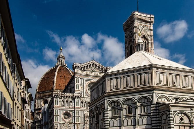 Skip-the-Line Florence Highlights and David Walking Tour - Crossing Ponte Santa Trinita and entering the Oltrarno mindset