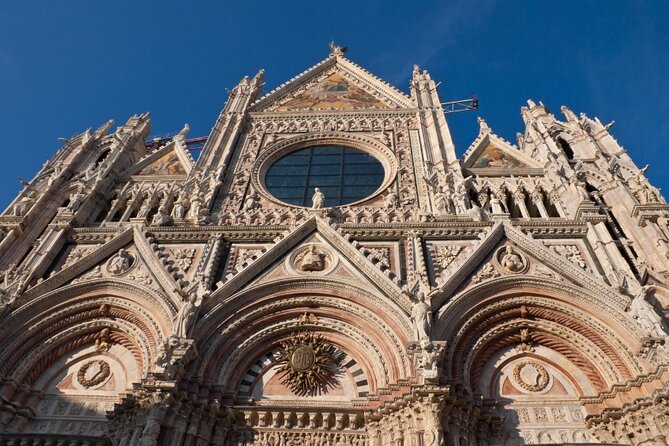 Skip the Line: Siena Duomo and City Walking Tour - Piazza Salimbeni and Rocca Salimbeni: Neighborhood Pride in Plain Sight