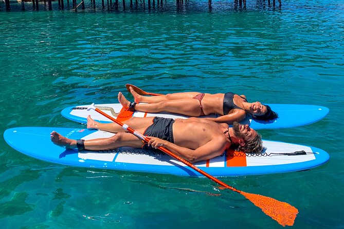 Small group paddle boarding tour to Bagni Regina Giovanna - Punta del Capo feels different from shore