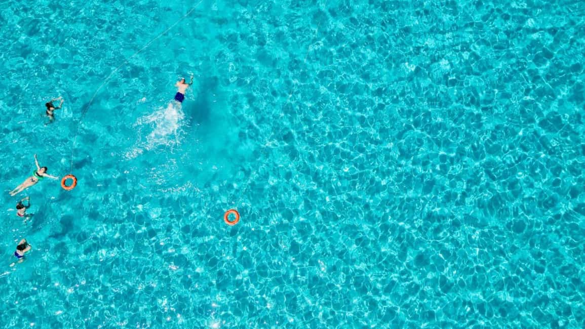 Stintino: Half-day catamaran tour to La Pelosa with aperitif - La Pelosa swimming stop: the turret view is the whole point