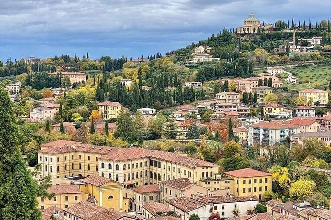 Tour to discover the Unique History of Verona, the City of Art - Piazza dei Signori and Piazza delle Erbe: politics in one plaza, people in the next