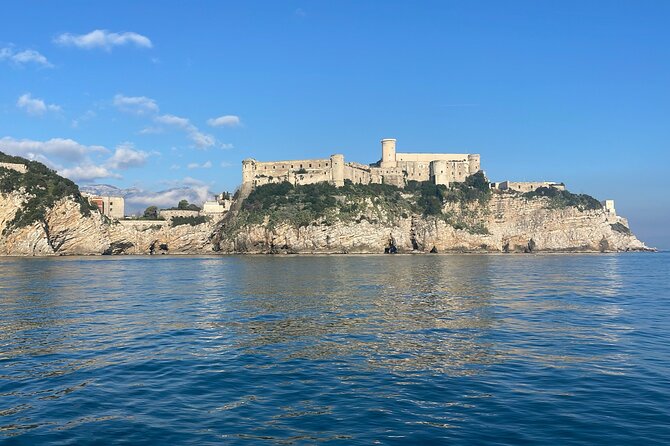 Tourist boat tour of the Gaeta peninsula - Castello Angioino and Punta Stendardo: cliffs, old villages, and sea-level history