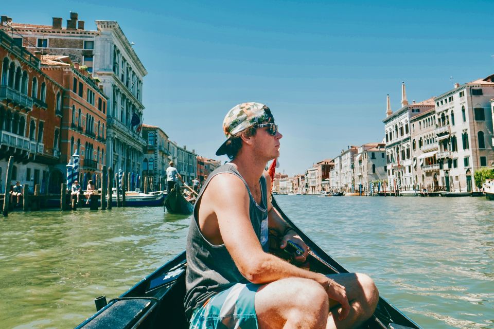 Venice: Shared Gondola Ride through the Lagoon City - The gondola ride feel: velvet seat, bridges, and canal texture